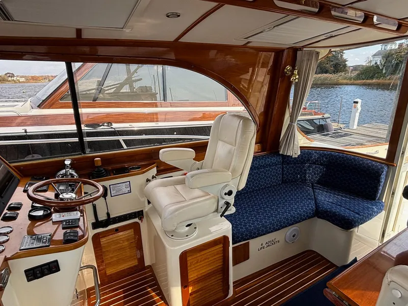 Slide: The Image of Interior of 2005 Hinckley Talaria 44 MY yacht with helm and seating area. - 17