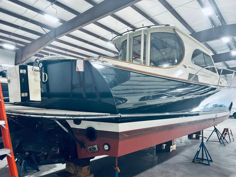 Slide: The Image of 2005 Hinckley Talaria 44 MY yacht in a storage facility. - 23