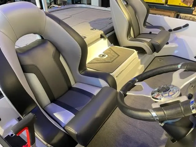 Slide: The Image of 2025 Nitro Z20 XL Pro boat interior with sleek seats and modern steering wheel. - 2