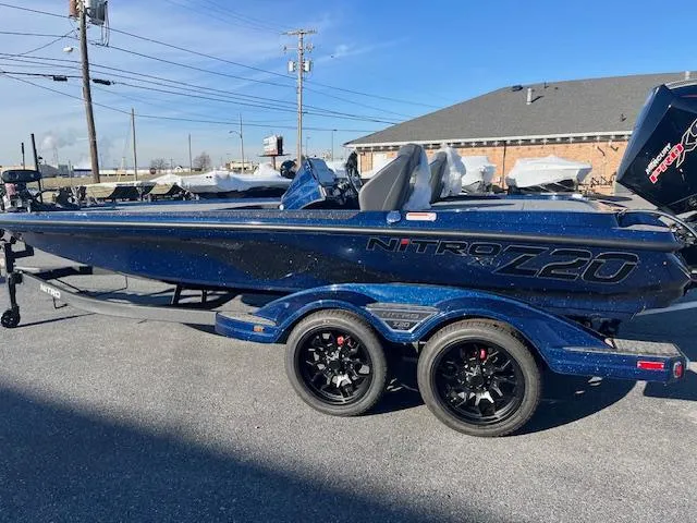 Slide: The Image of 2025 Nitro Z20 XL Pro boat on trailer, parked outdoors. - 0
