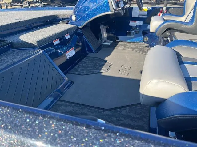 Slide: The Image of 2025 Nitro Z20 XL Pro boat interior with blue and gray seating and dashboard. - 11