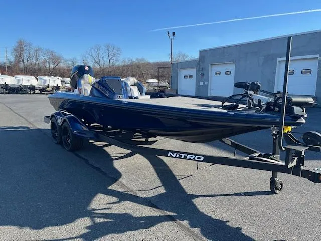 Slide: The Image of 2025 Nitro Z20 XL Pro boat on trailer in parking lot. - 12