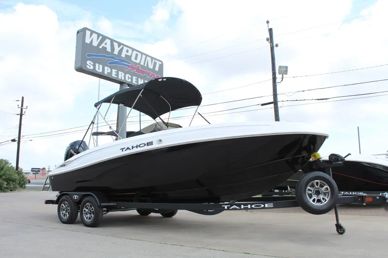 The Image of 2025 Tahoe T21 boat on trailer at Waypoint Supercenter dealership. - 1