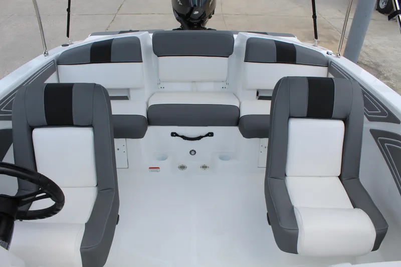 Slide: The Image of 2025 Tahoe T21 boat interior with gray and white seating arrangement. - 13