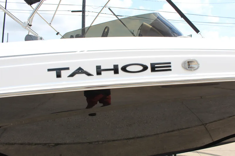 Slide: The Image of 2025 Tahoe T21 boat with sleek design and logo detail. - 17
