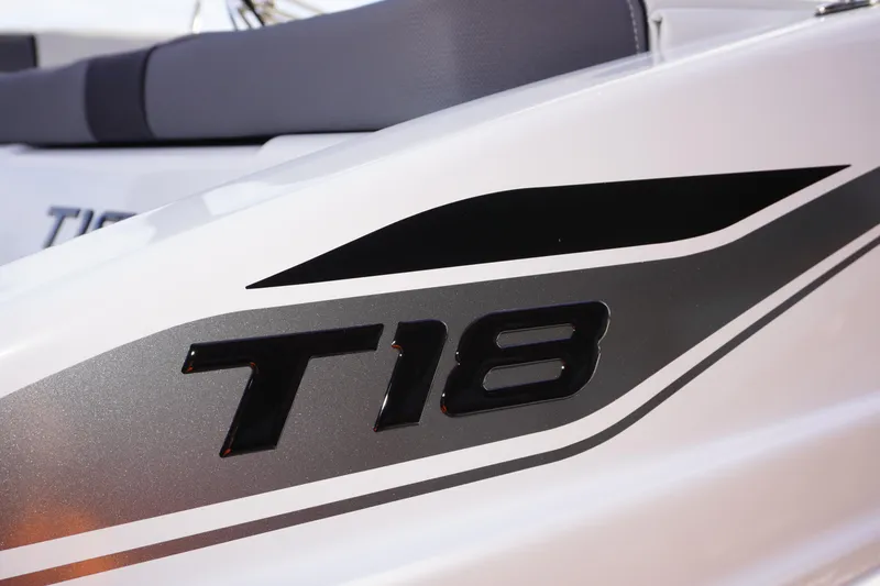 Slide: The Image of 2025 Tahoe T18 boat close-up, featuring sleek black and silver design elements. - 3