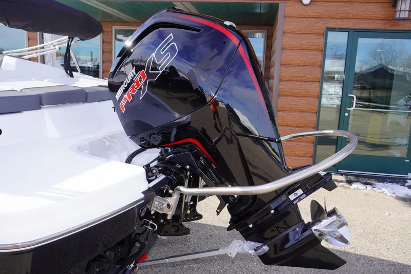 Slide: The Image of 2025 Tahoe T18 boat with Mercury Pro XS outboard motor, docked outdoors. - 9