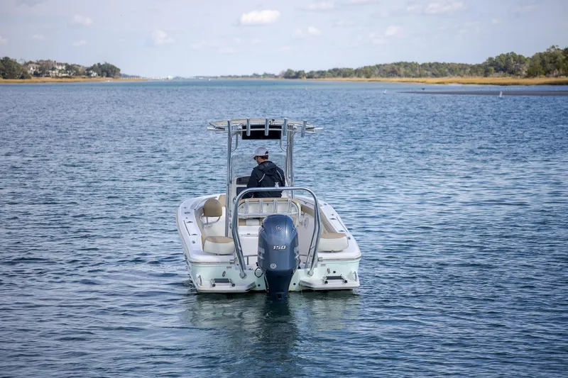 Slide: The Image of 2019 Pioneer 202 Sportfish boat cruising on a calm lake. - 1
