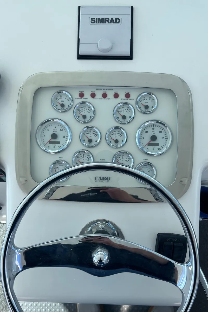 Slide: The Image of Dashboard of a 2001 Cabo 45 Express boat with Simrad navigation system. - 24