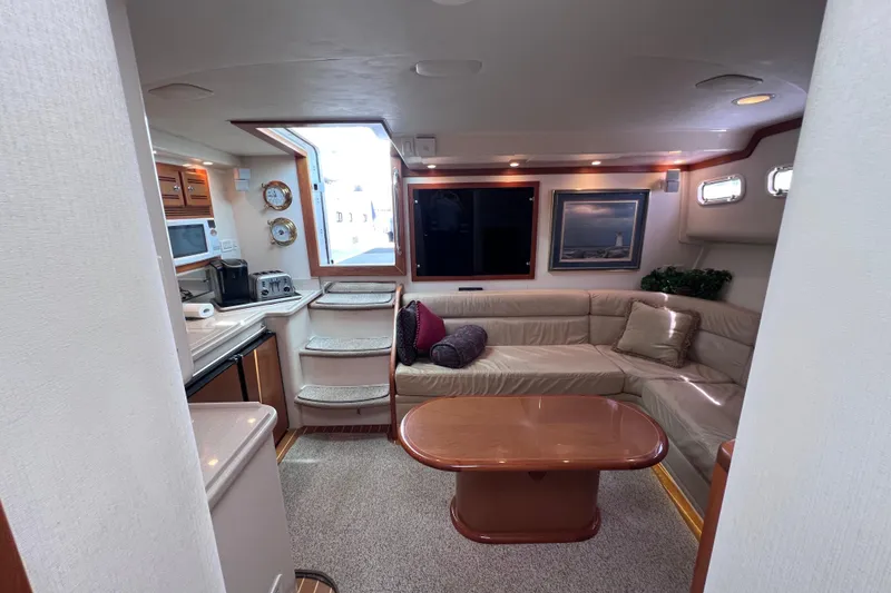 Slide: The Image of Luxurious interior of 2001 Cabo 45 Express yacht with cozy seating and modern amenities. - 28