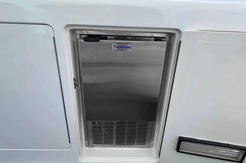 Slide: The Image of Stainless steel Raritan ice maker on a 2001 Cabo 45 Express yacht. - 31