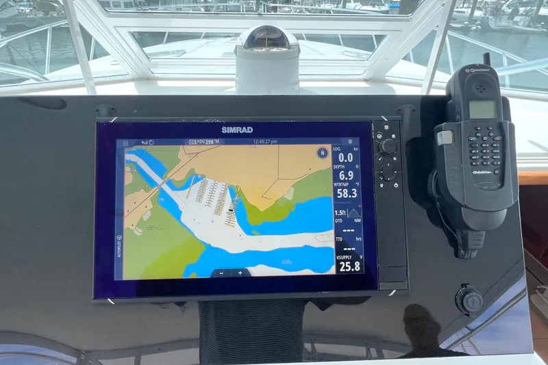 Slide: The Image of Navigation system on 2001 Cabo 45 Express boat dashboard with marine electronics. - 34