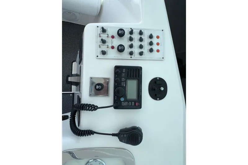 Slide: The Image of Control panel of a 2001 Cabo 45 Express boat with radio and switches. - 35