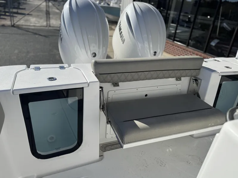 Slide: The Image of 2025 Sportsman Open 262 Center Console with dual Yamaha engines and foldable seating. - 11