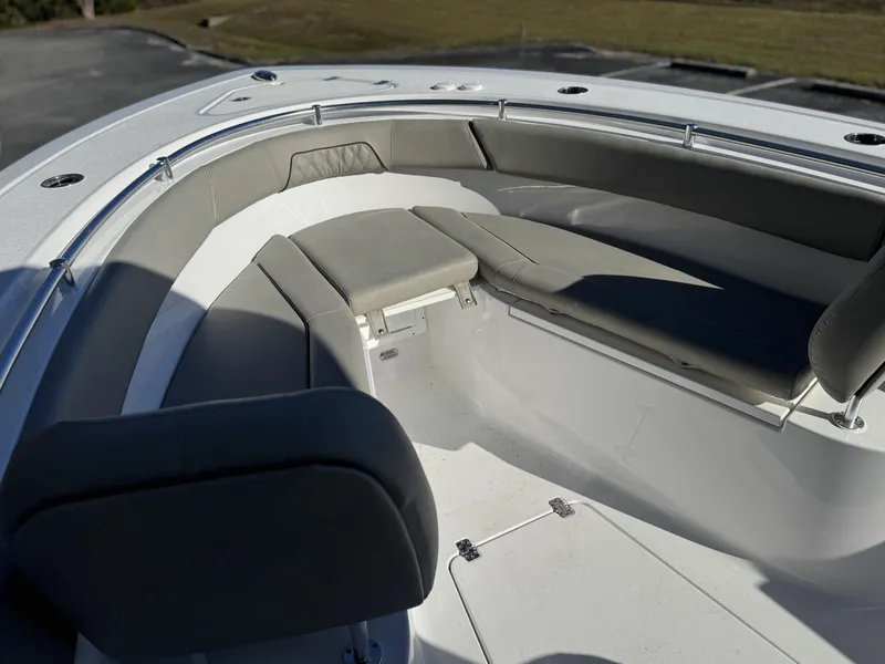 Slide: The Image of 2025 Sportsman Open 262 Center Console boat with cushioned seating area. - 14
