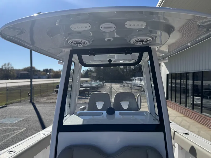 Slide: The Image of 2025 Sportsman Open 262 Center Console boat with T-top and seating. - 16