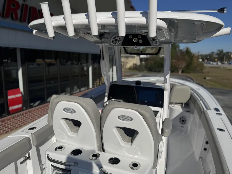 Slide: The Image of 2025 Sportsman Open 262 Center Console boat interior with dual seats and control panel. - 9