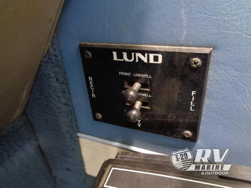 Slide: The Image of Control panel of a 1994 Lund 1775 Pro V boat, featuring livewell switches. - 10