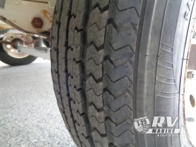 Slide: The Image of Close-up of a tire on a 1994 Lund 1775 Pro V trailer. - 13