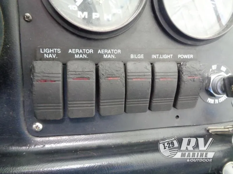 Slide: The Image of Dashboard switches of a 1994 Lund 1775 Pro V boat. - 9