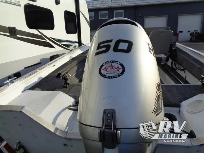 Slide: The Image of 1999 Starfire 160 boat with 50 HP outboard motor, RV Marine branding visible. - 5