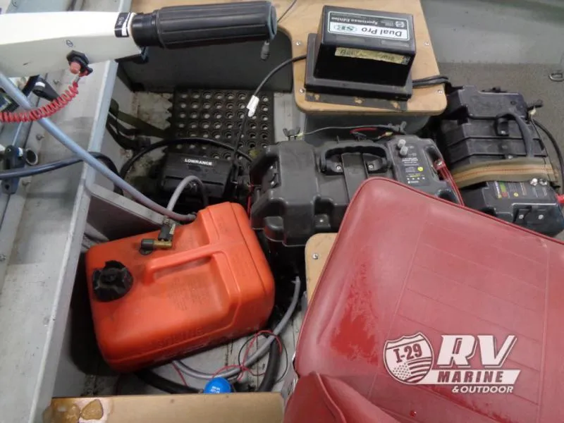 Slide: The Image of Boat interior with red seat, fuel tank, and battery setup, SSV 14 model, 2004. - 8