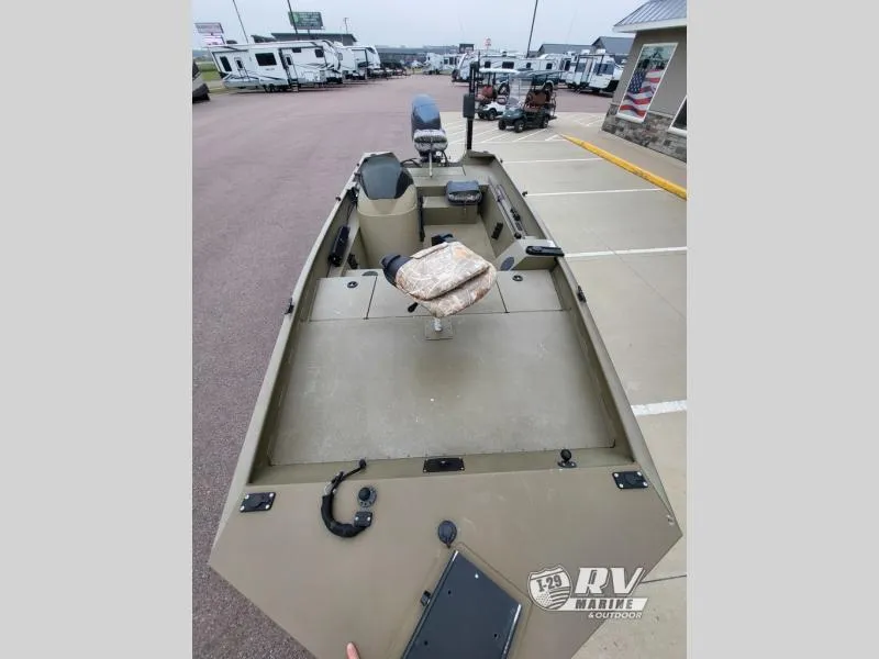 Slide: The Image of 2015 G3 1860SC DLX boat in parking lot, surrounded by RVs. - 7