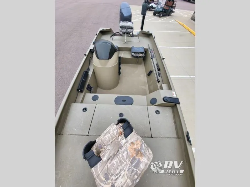 Slide: The Image of 2015 G3 1860SC DLX boat interior with camouflage seats and steering console. - 8