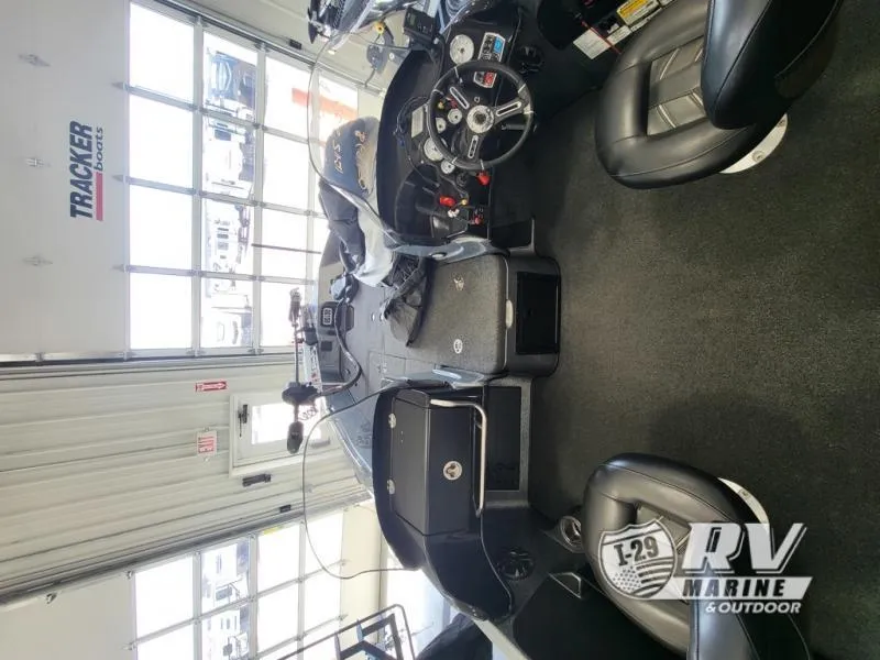 Slide: The Image of 2018 Nitro ZV21 boat interior with steering wheel and seating in showroom. - 3