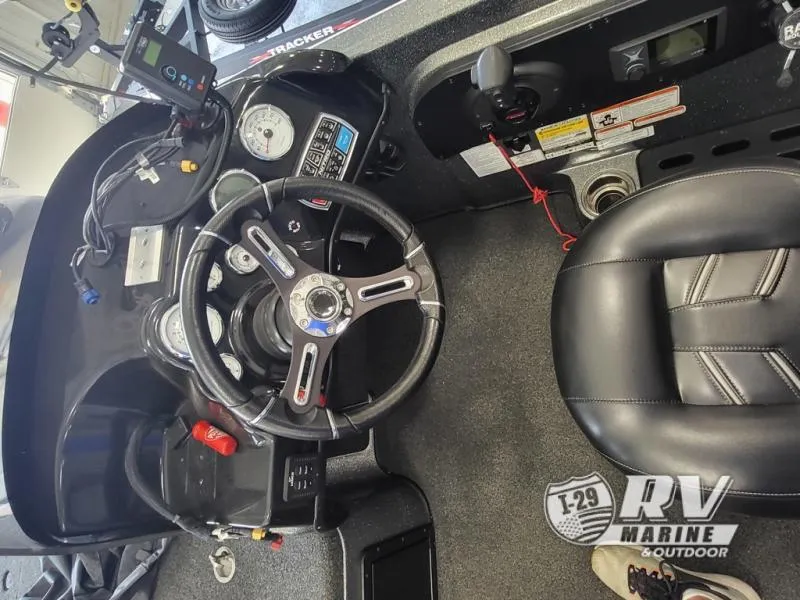 Slide: The Image of 2018 Nitro ZV21 boat cockpit with steering wheel and dashboard controls. - 6
