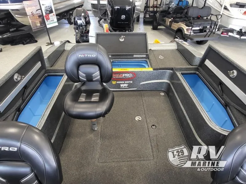 Slide: The Image of 2018 Nitro ZV21 boat interior with seating and storage compartments at RV Marine & Outdoor showroom. - 8