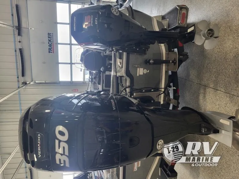 Slide: The Image of 2018 Nitro ZV21 boat with dual Mercury Verado 350 engines in a showroom. - 9