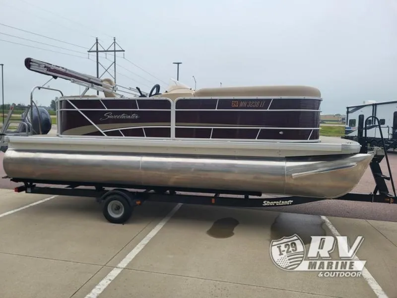 Slide: The Image of 2018 Cruisers 2086 pontoon boat on trailer at RV Marine dealership. - 11