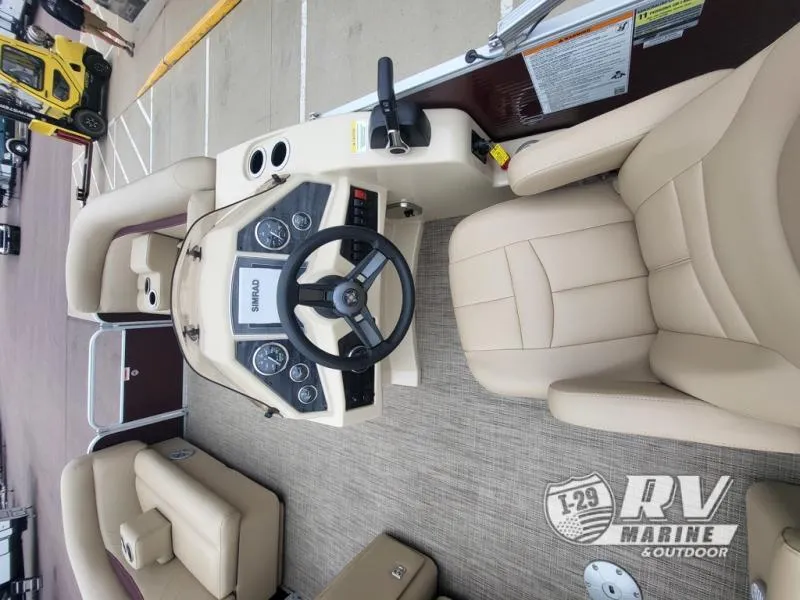 Slide: The Image of Cruisers 2086 boat interior, 2018 model, featuring beige seating and steering console. - 7