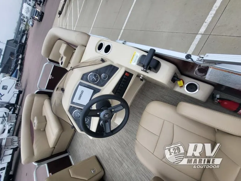 Slide: The Image of 2018 Cruisers 2086 boat interior with beige seating and steering wheel, displayed at RV Marine. - 8