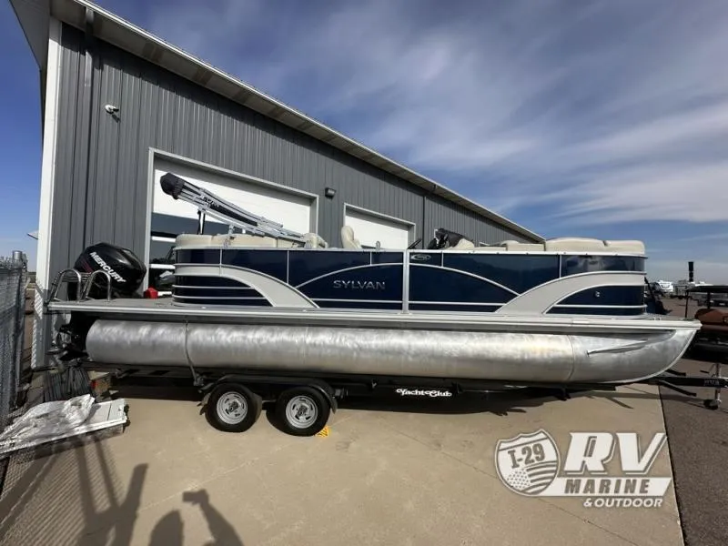 Slide: The Image of 2018 Mirage 8522 pontoon boat on trailer outside RV Marine building. - 1