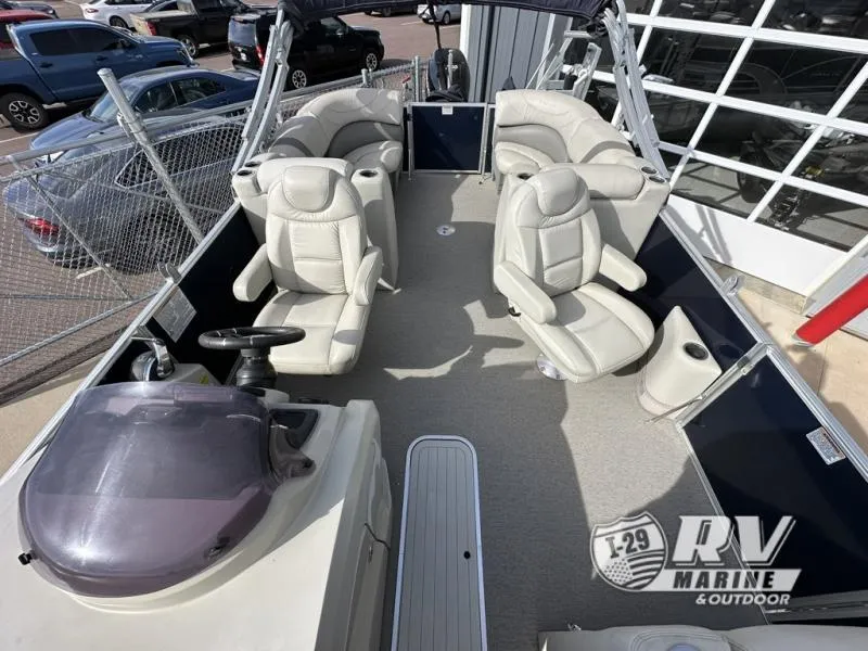 Slide: The Image of 2018 Mirage 8522 boat interior with plush seating and steering console. - 14