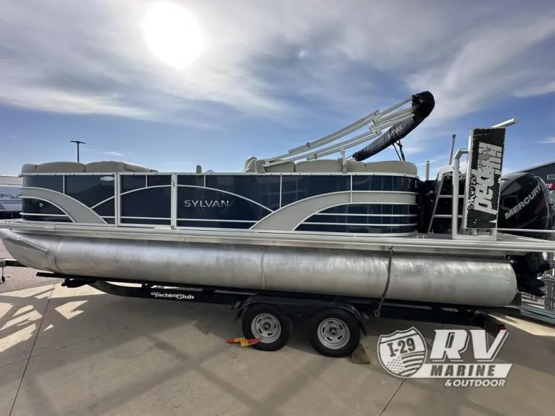 Slide: The Image of 2018 Mirage 8522 pontoon boat on trailer under sunny sky. - 5