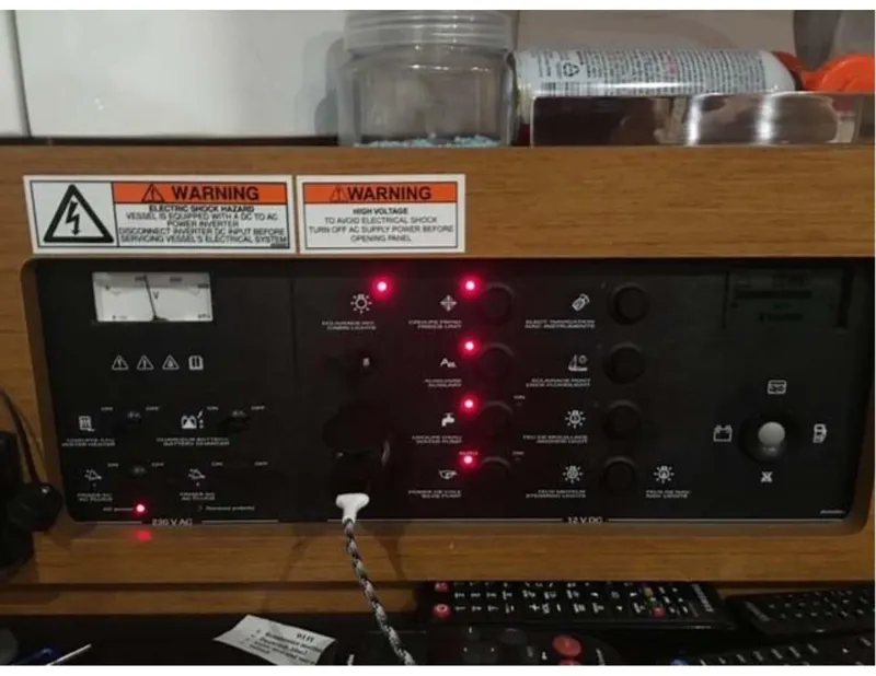 Slide: The Image of Control panel of a 2017 Jeanneau Sun Odyssey 44 DS sailboat with warning labels. - 14