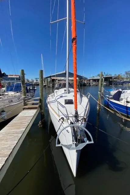 Slide: The Image of 2017 Jeanneau Sun Odyssey 44 DS sailboat docked at marina, clear blue sky. - 2