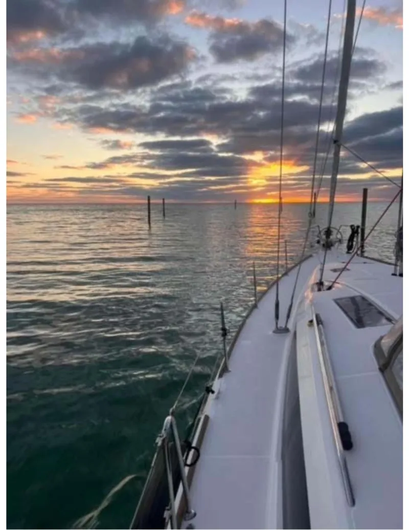 Slide: The Image of Jeanneau Sun Odyssey 44 DS sailing at sunset, 2017 model, calm sea and vibrant sky. - 21