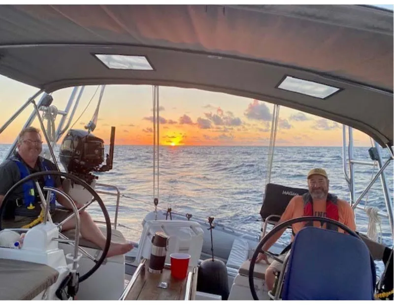 Slide: The Image of Two people sailing on a 2017 Jeanneau Sun Odyssey 44 DS at sunset. - 22