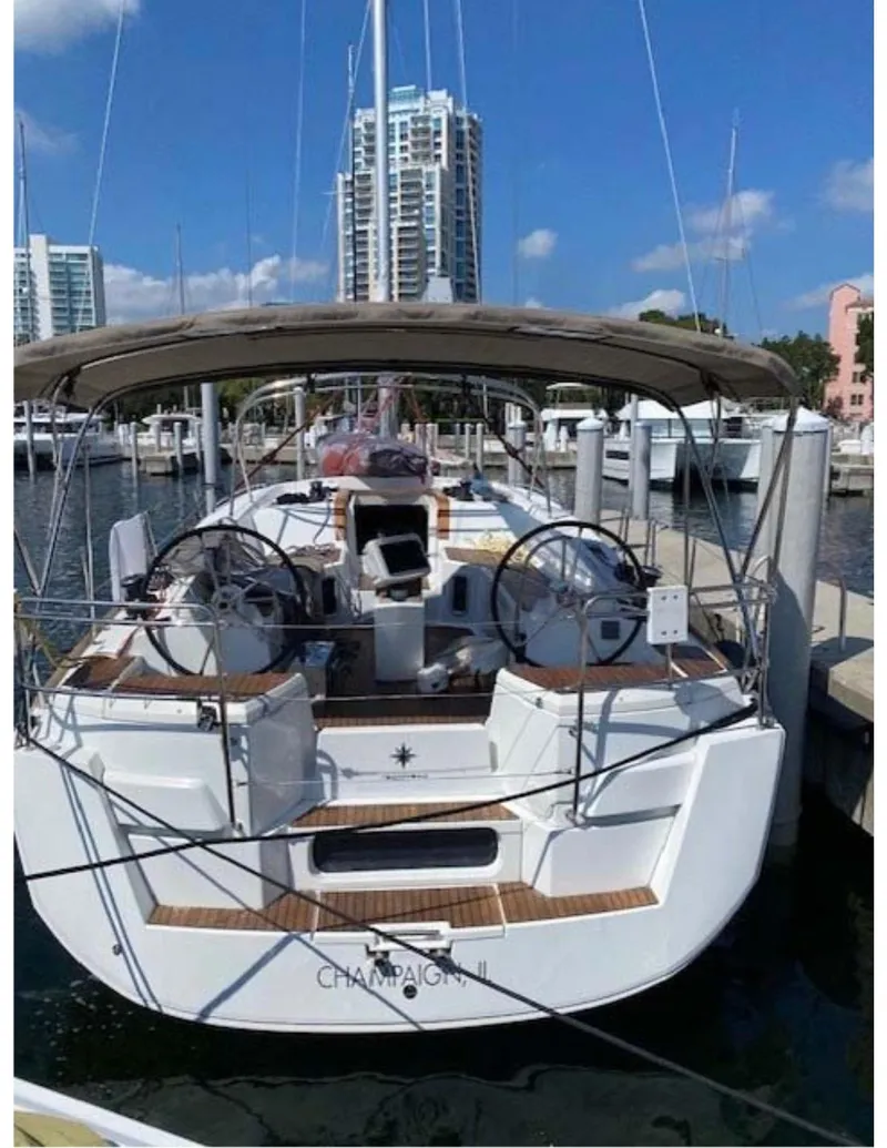 Slide: The Image of 2017 Jeanneau Sun Odyssey 44 DS yacht docked at marina, clear sky background. - 25