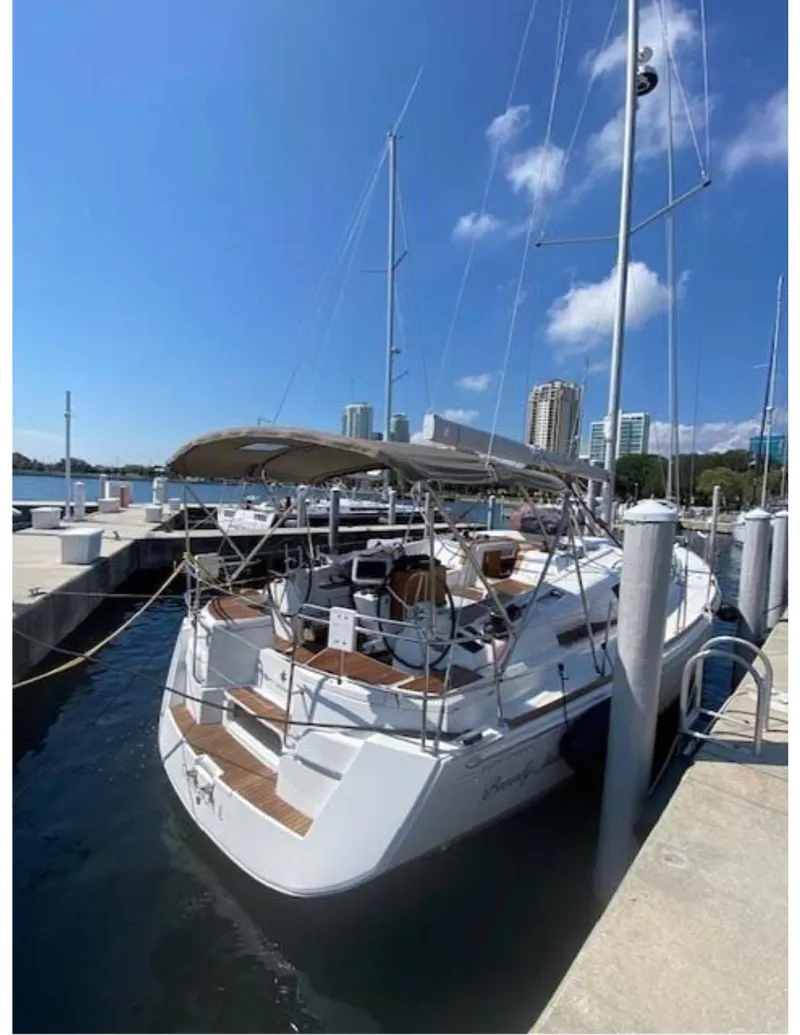 Slide: The Image of 2017 Jeanneau Sun Odyssey 44 DS yacht docked at marina under clear blue sky. - 26