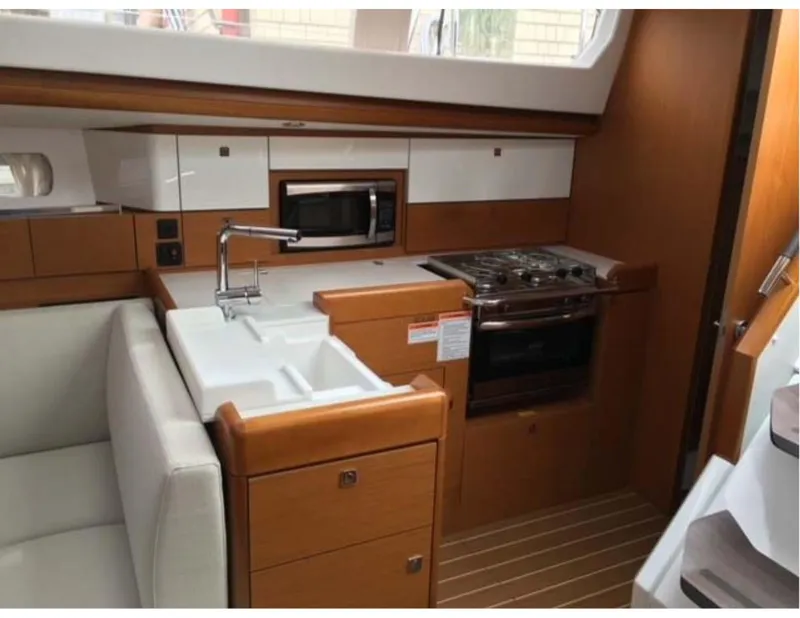 Slide: The Image of Interior of 2017 Jeanneau Sun Odyssey 44 DS yacht kitchen with stove and sink. - 7