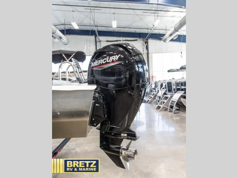 Slide: The Image of 2023 Party Barge 22 RF XP3 with Mercury outboard motor in showroom. - 14