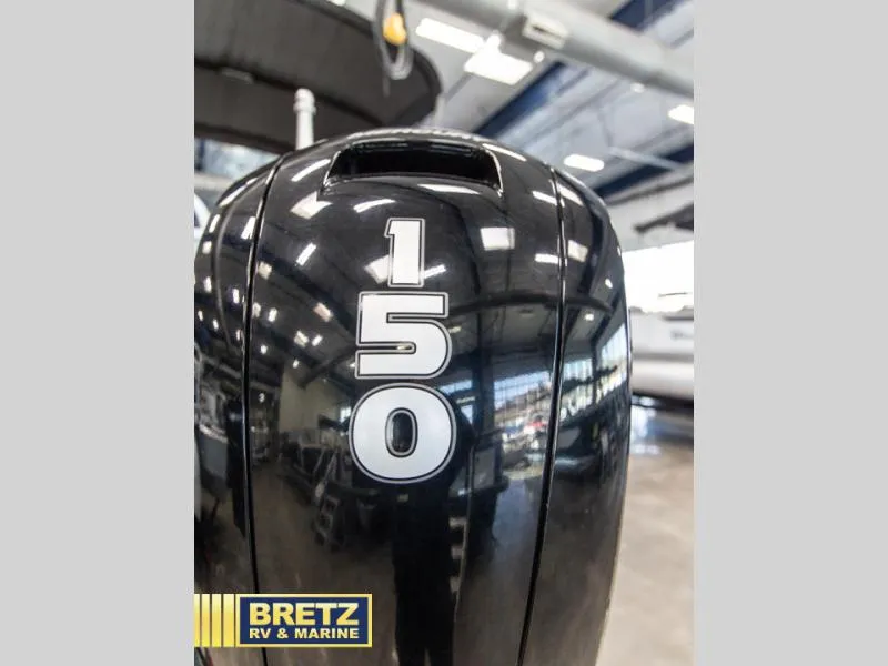 Slide: The Image of Close-up of a 150 HP outboard motor on a 2023 Party Barge 22 RF XP3. - 15
