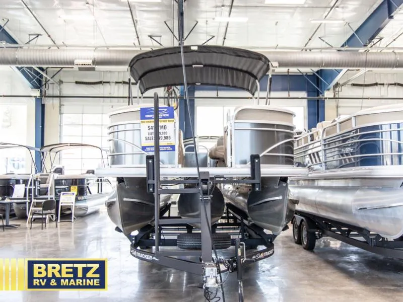 Slide: The Image of 2023 Party Barge 22 RF XP3 pontoon boat displayed at Bretz RV & Marine showroom. - 3