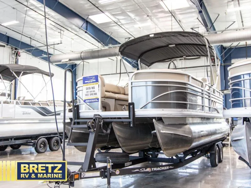 Slide: The Image of 2023 Party Barge 22 RF XP3 pontoon boat displayed at Bretz RV & Marine showroom. - 4