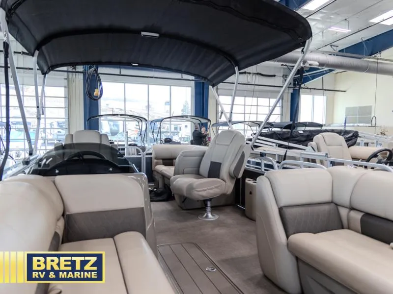 Slide: The Image of 2023 Party Barge 22 RF XP3 pontoon boat interior at Bretz RV & Marine showroom. - 9